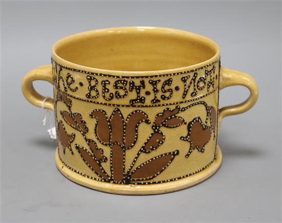 A 17th century style slipware posset pot by John Hudson, impressed H to base, H 12.5cm Dia 17cm